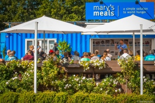  visitors in front of Mary's Meals Information Center in Medjugorje